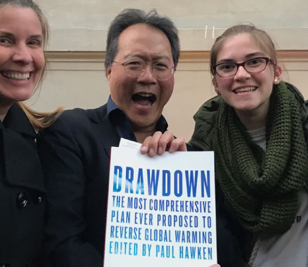 Yo-Yo Ma receives a copy of Drawdown